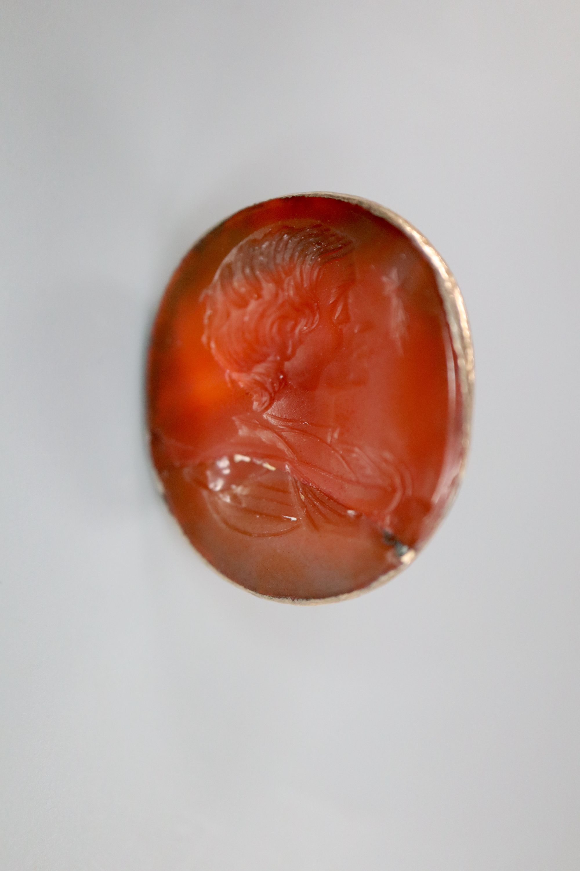 A 19th century yellow metal and carnelian set intaglio fob seal(a.f.) and an Edwardian silver double stamp case